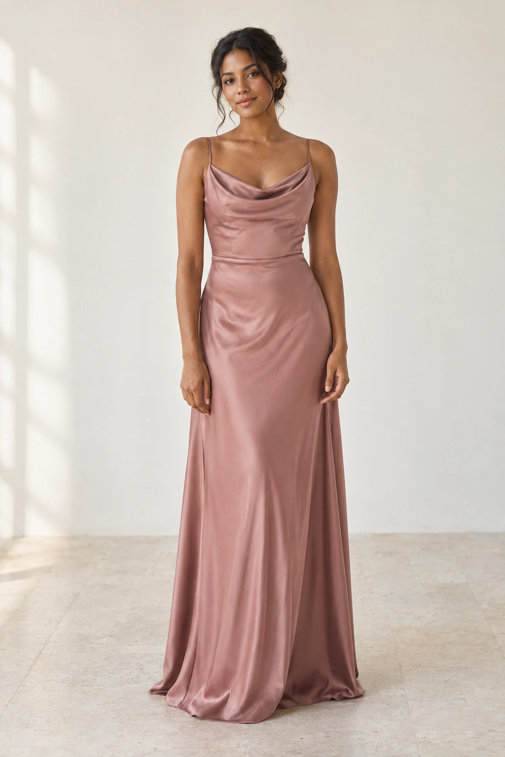 Dusty rose satin bridesmaid dress with a draped neckline